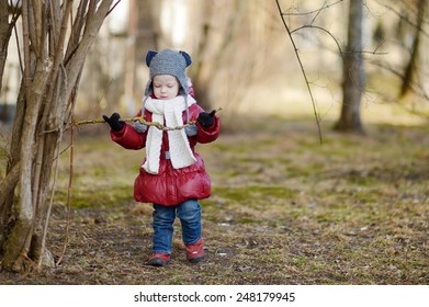 Adorable Toddler Girl Having Fun On Early Spring Outdoors