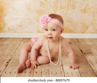 Adorable Young Baby Girl Wearing A Vintage Pearl Necklace And Pink Rose Headband