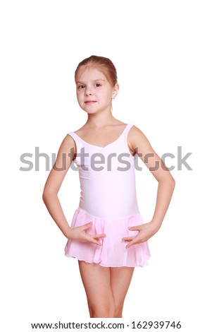 Adorable young ballerina posing on camera
