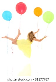 Adorable young girl child floating away on balloons with clipping path over white.