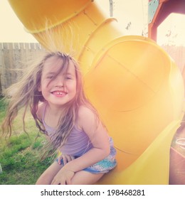 Adorable Young Girl Having Fun On Slide - Instagram Effect