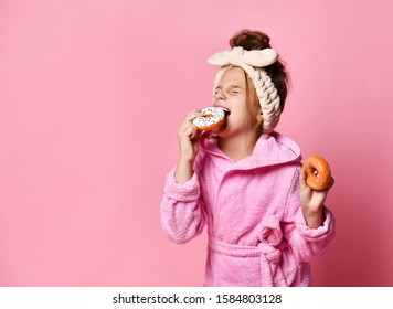 Adorable Young Teenage Girl In A Hair Bandand And A Plush Robe Is About To Eat Mouthwatering Glazed Donuts