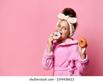 Adorable Young Teenage Girl In A Hair Bandand And A Plush Robe Is About To Eat Mouthwatering Glazed Donuts