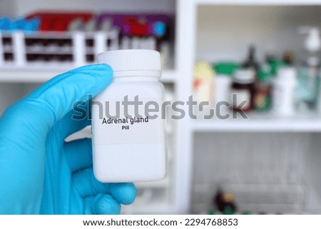 Adrenal gland pill in white bottle, pill stock, medical or pharmacy concept