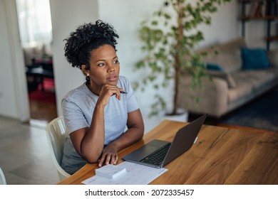 Adult african-american woman, thinking about the plot of her new book - Powered by Shutterstock