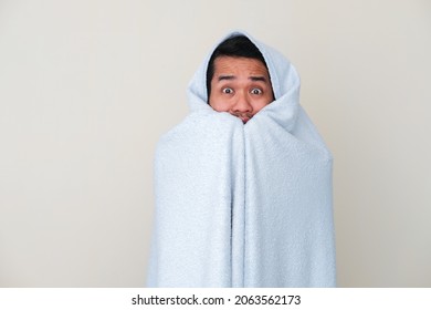 Adult Asian Man Cover His Body With Blanket And Showing Scared Face Expression