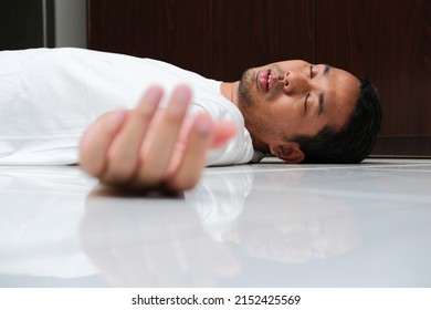 Adult Asian man fainted in the floor - Shutterstock ID 2152425569