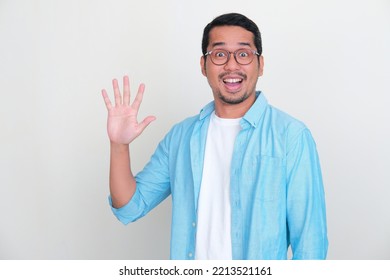 Adult Asian Man Looking At Camera With Wow Expression While Showing Five Fingers Sign