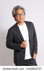The adult Asian man on the white background.