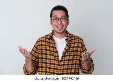 Adult Asian Man Showing Cheerful Face Expression With Both Hands Open