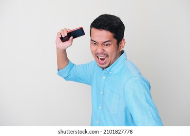 Adult Asian Man Showing Rage Expression And Want To Slam His Mobile Phone