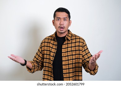 Adult Asian man showing shocked face expression isolated white backgroud