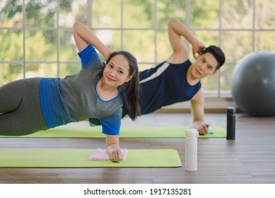 Adult Asian Man And Woman Family Wearing Sport Outfit Do Exercise Workout Yoga For Healthy Self Care At Home