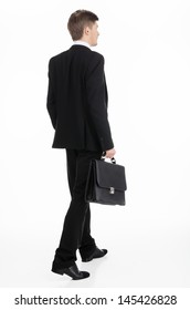 Adult Businessman Carrying A Briefcase Walking Away