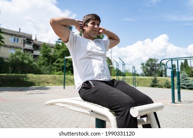 Adult Caucasian Man Training Outdoor Male Doing Sit Ups In Sunny Day Street Workout Real People Concept