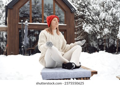 Adult caucasian woman breathing fresh air in winter time - Powered by Shutterstock