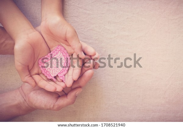 adult and child hands holding\
intestine shape, healthy bowel degestion, leaky gut, probiotics and\
prebotics for gut health, colon, gastric, stomach cancer\
concept