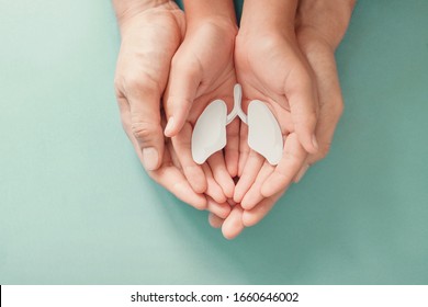 Adult and child hands holding lung, world tuberculosis day, world no tobacco day, covid, long covid,  Pneumonia,Pulmonary hypertension, copd, eco air pollution,organ donation, healing concept