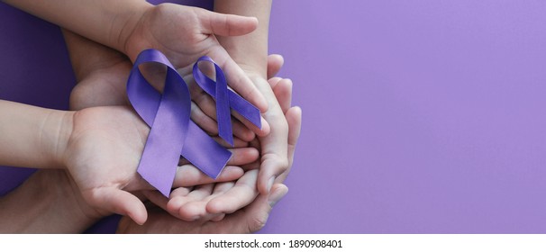 Adult And Child Hands Holding Purple Ribbons, Alzheimer's Disease, Pancreatic Cancer, Epilepsy Awareness, World Cancer Day On Purple Background