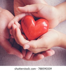 Adult And Child Hands Holding Red Heart, Health Care, Love, Donate, Insurance And Family Concept