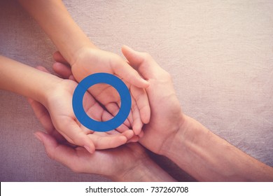 Adult And Child Holding Blue Circle, Copy Space Background, World Diabetes Day