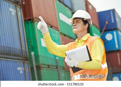 adult chinese terminal cargo dock warehouse worker in front of container