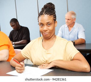 Adult College Student With Cerebral Palsy, Taking A Test.