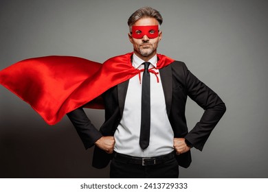 Adult confident employee business man corporate lawyer wear classic formal black red super hero suit shirt tie work in office stand akimbo look camera isolated on plain grey background studio portrait - Powered by Shutterstock