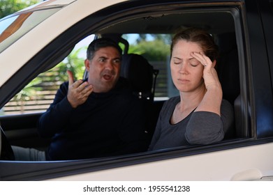 Adult Couple (male And Female Age 30-40) Having An Argument In A Car.