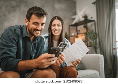 adult couple prepare to call dear people to share good news about pregnancy with them - Powered by Shutterstock