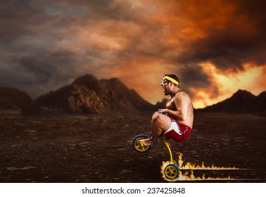 Adult Crazy Man Cycling On Child's Bicycle