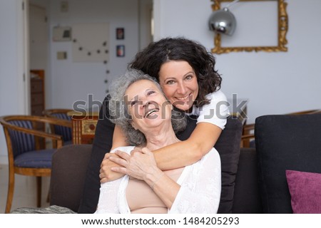 Similar – Female caretaker posing with elderly patient