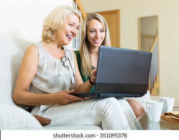 Adult Daughter Teaching Mature Mother To Computer Literacy