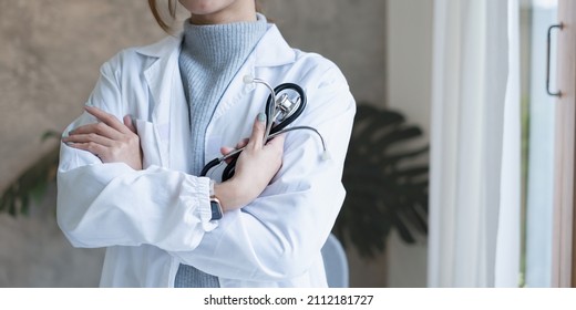 Adult Doctor Or Surgeon In A Classroom, Ready To Instruct. Healthcare And Medical Concept.