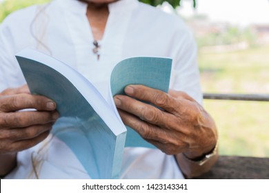 Adult Education Learning Studying Concept : Happy Asian Elderly  Retired Man Sitting Reading Book At Garden Home Outdoor For Learning Or Relax By Self