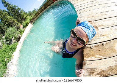 An Adult Female Goes For A Swim At Granite Creek Hot Springs, A Natural Hot Spring In Jackson Hole, Wyoming. Fisheye View