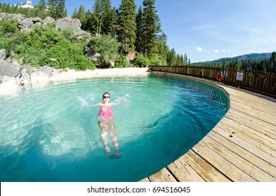 An Adult Female Goes For A Swim At Granite Creek Hot Springs, A Natural Hot Spring In Jackson Hole, Wyoming. Fisheye View