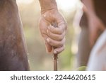 Adult hand wielding a working knife	