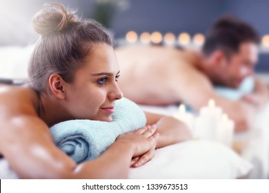 Adult happy couple relaxing in spa salon