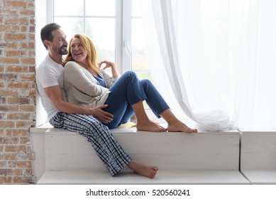 Adult Happy Couple Smiling At Home