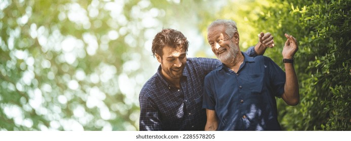 Adult hipster son fun hugging old senior father at home, two generations have a beard talking together and relaxing with smile, 2 man happy enjoy to living at home in father's day with love of family - Shutterstock ID 2285578205