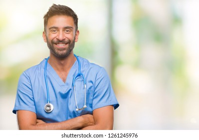 Adult Hispanic Doctor Or Surgeon Man Over Isolated Background Happy Face Smiling With Crossed Arms Looking At The Camera. Positive Person.