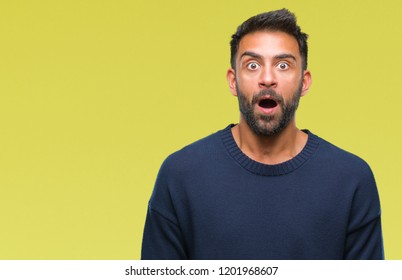 Adult Hispanic Man Over Isolated Background Afraid And Shocked With Surprise Expression, Fear And Excited Face.