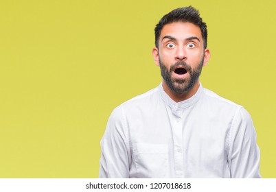 Adult Hispanic Man Over Isolated Background Afraid And Shocked With Surprise Expression, Fear And Excited Face.