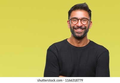 Adult Hispanic Man Wearing Glasses Over Isolated Background Happy Face Smiling With Crossed Arms Looking At The Camera. Positive Person.