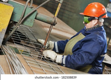 adult industrial female worker spot welder in factory workshop - Powered by Shutterstock