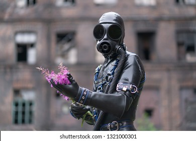 Adult Kinky Man Dressed In Fetish Latex Rubber Costume With Kinky Mask