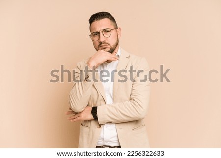 Adult latin business man cut out isolated suspicious, uncertain, examining you.