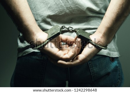 
Adult male arrested and handcuffed