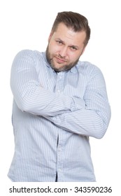 Adult Male With A Beard. Isolated On White Background. Closed Defensive Posture. Crossed Arms. Body Language